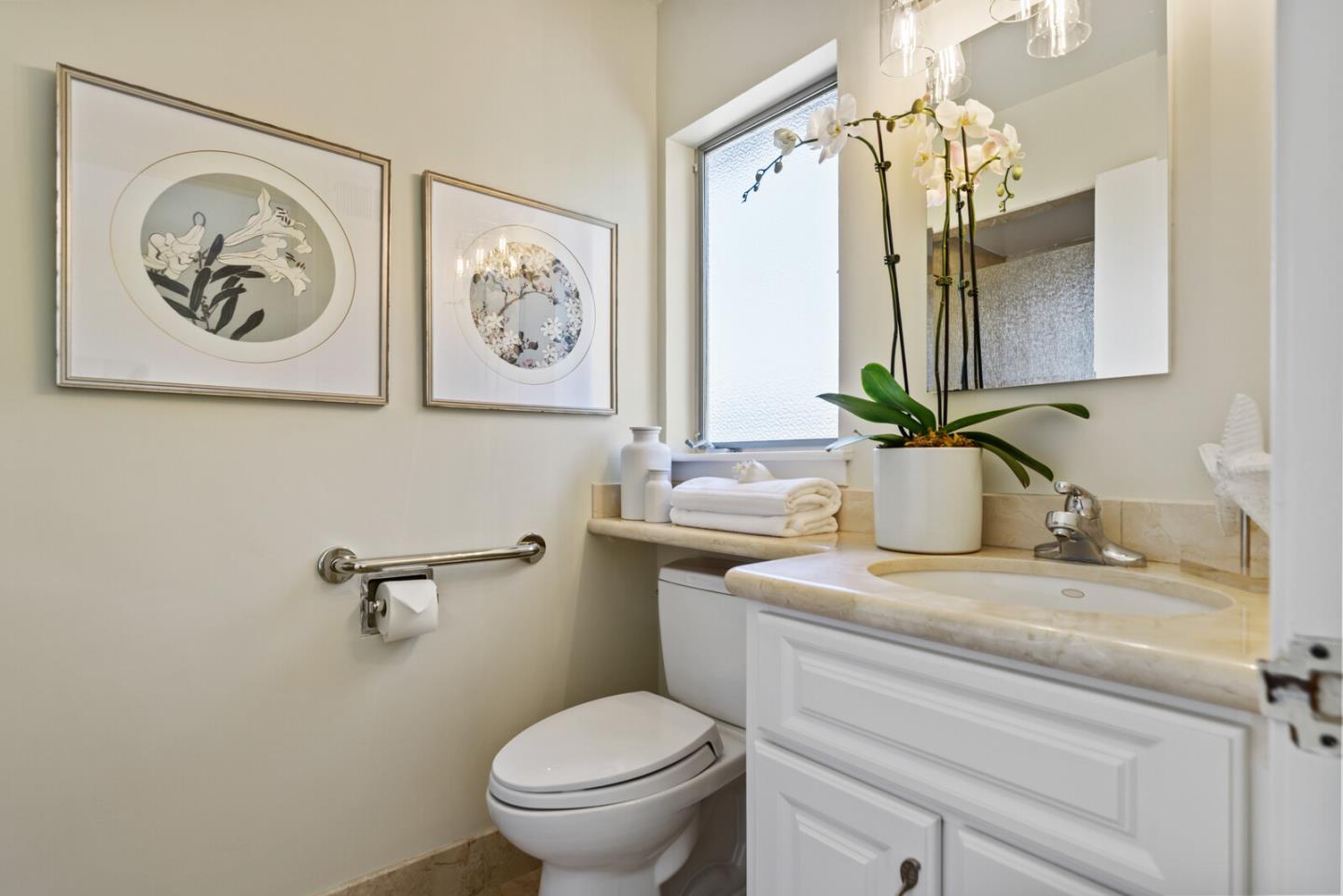 100 Parkview Drive San Bruno, CA 94066 - Photo 15 of 25 a bathroom with a toilet a sink and mirror