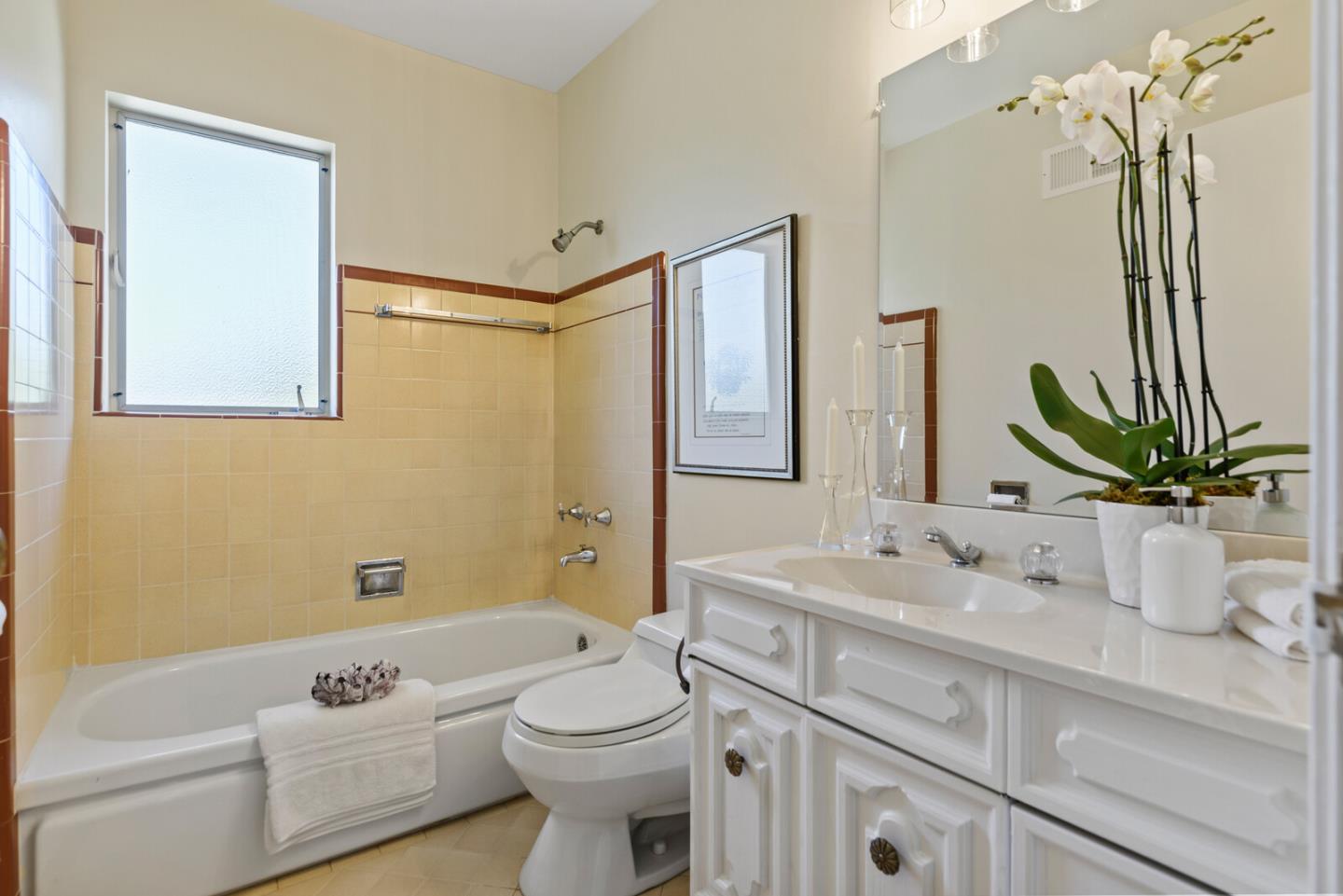 100 Parkview Drive San Bruno, CA 94066 - Photo 18 of 25 a bathroom with a sink a toilet and shower
