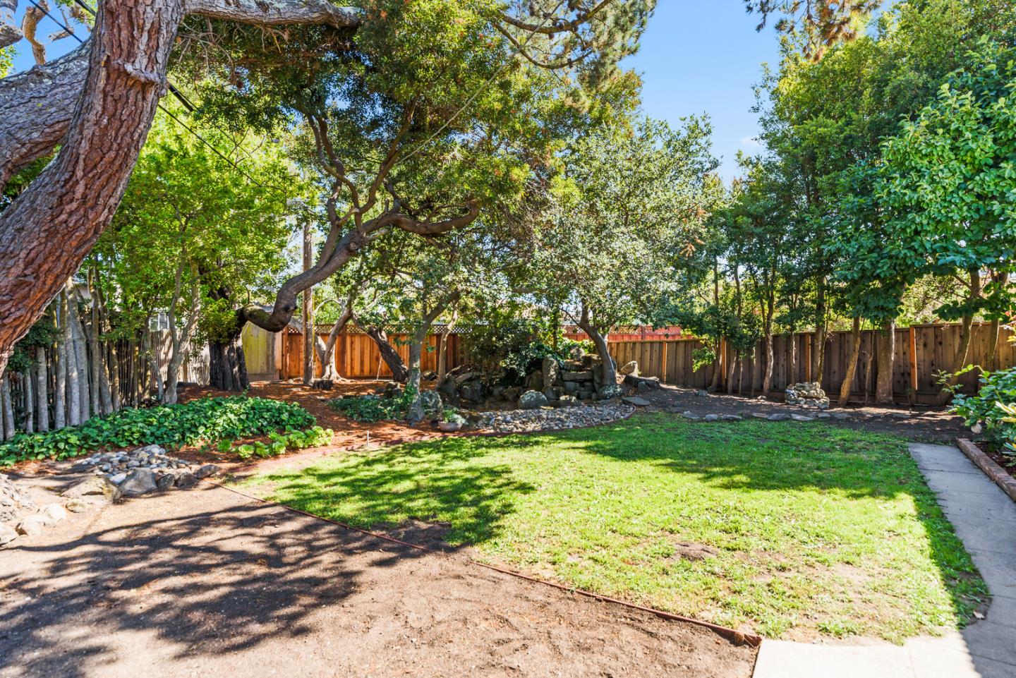 100 Parkview Drive San Bruno, CA 94066 - Photo 21 of 25 a backyard of a house with lots of green space