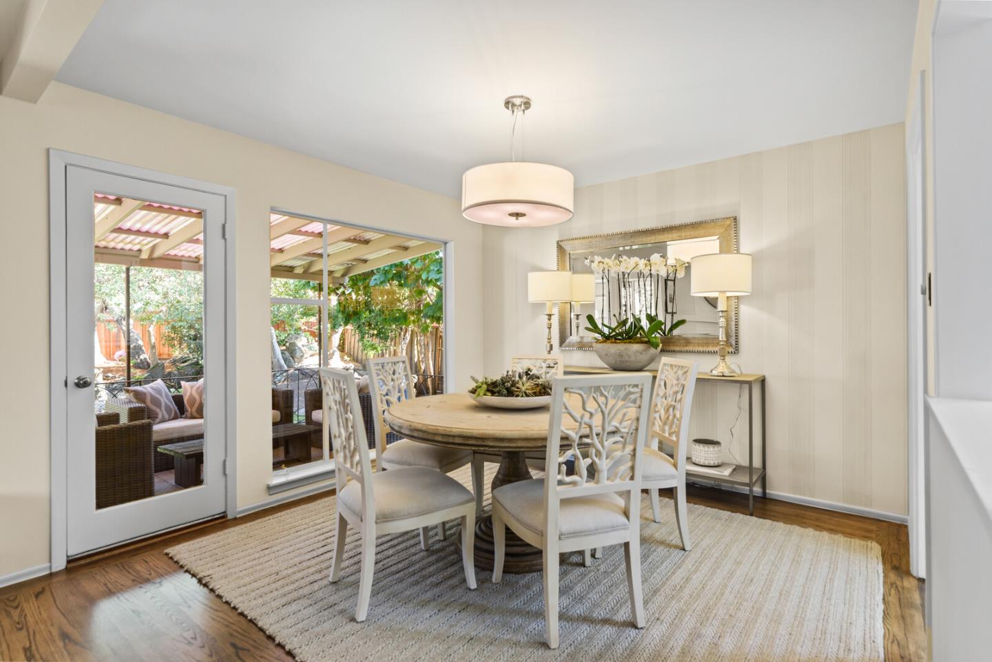 100 Parkview Drive San Bruno, CA 94066 - Photo 9 of 25 a dining room with furniture a chandelier and wooden floor