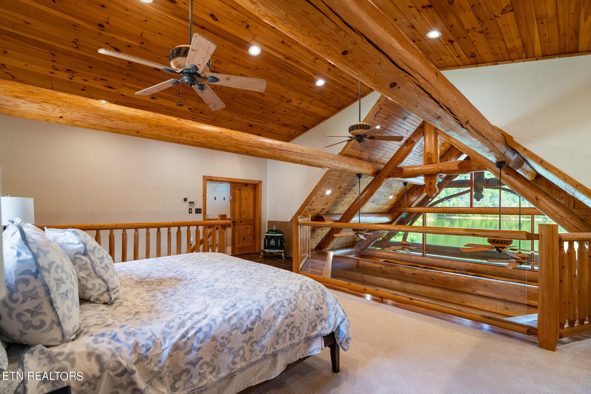 546 Bluff View Road New Tazewell, TN 37825 - Photo 24 of 60 a bedroom with a bed and a ceiling fan