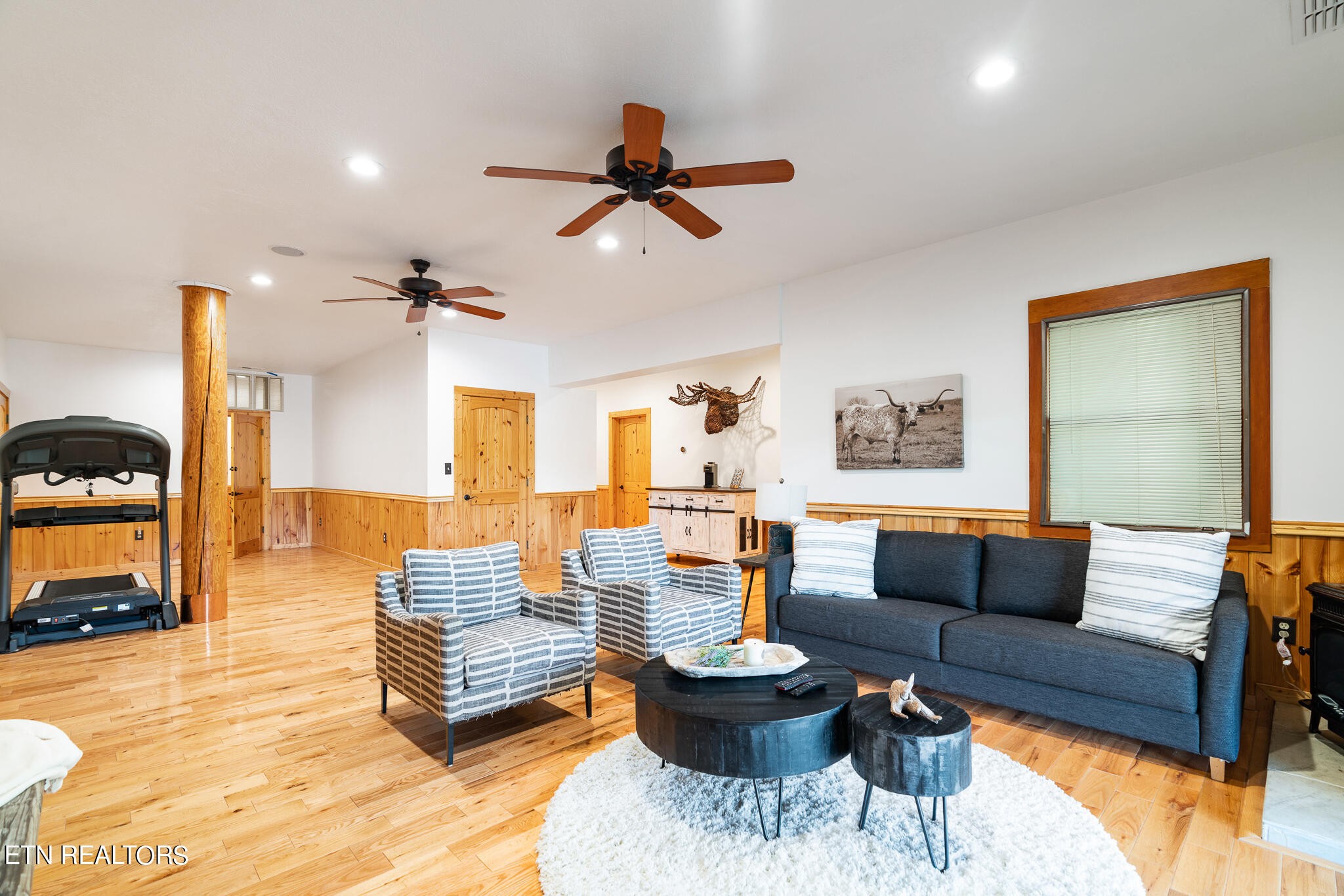 546 Bluff View Road New Tazewell, TN 37825 - Photo 30 of 60 a living room with furniture and a wooden floor