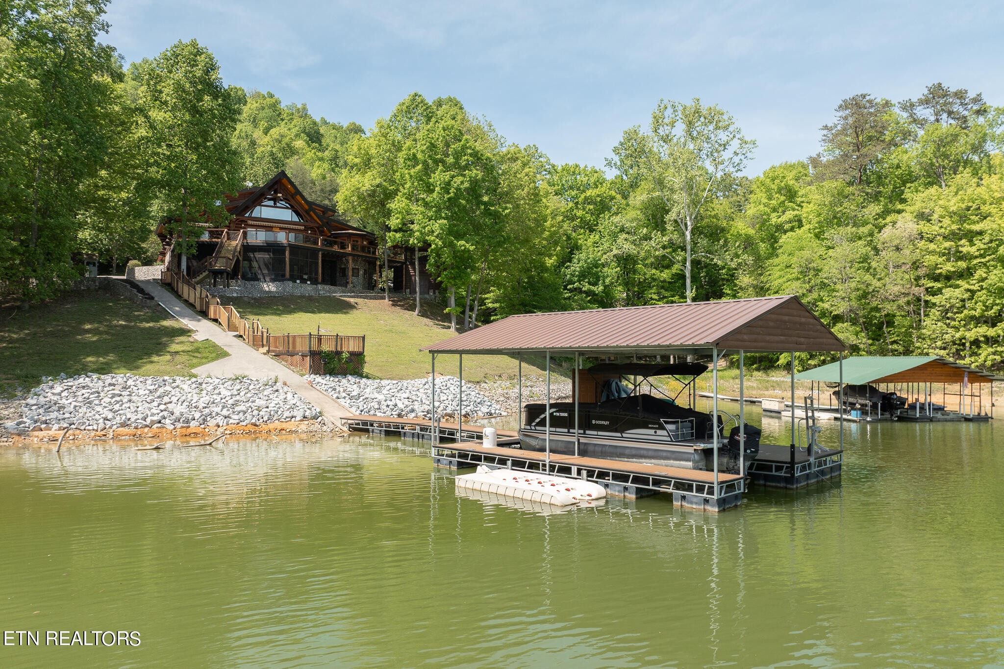 546 Bluff View Road New Tazewell, TN 37825 - Photo 53 of 60 a view of an ocean with boats and trees in the background