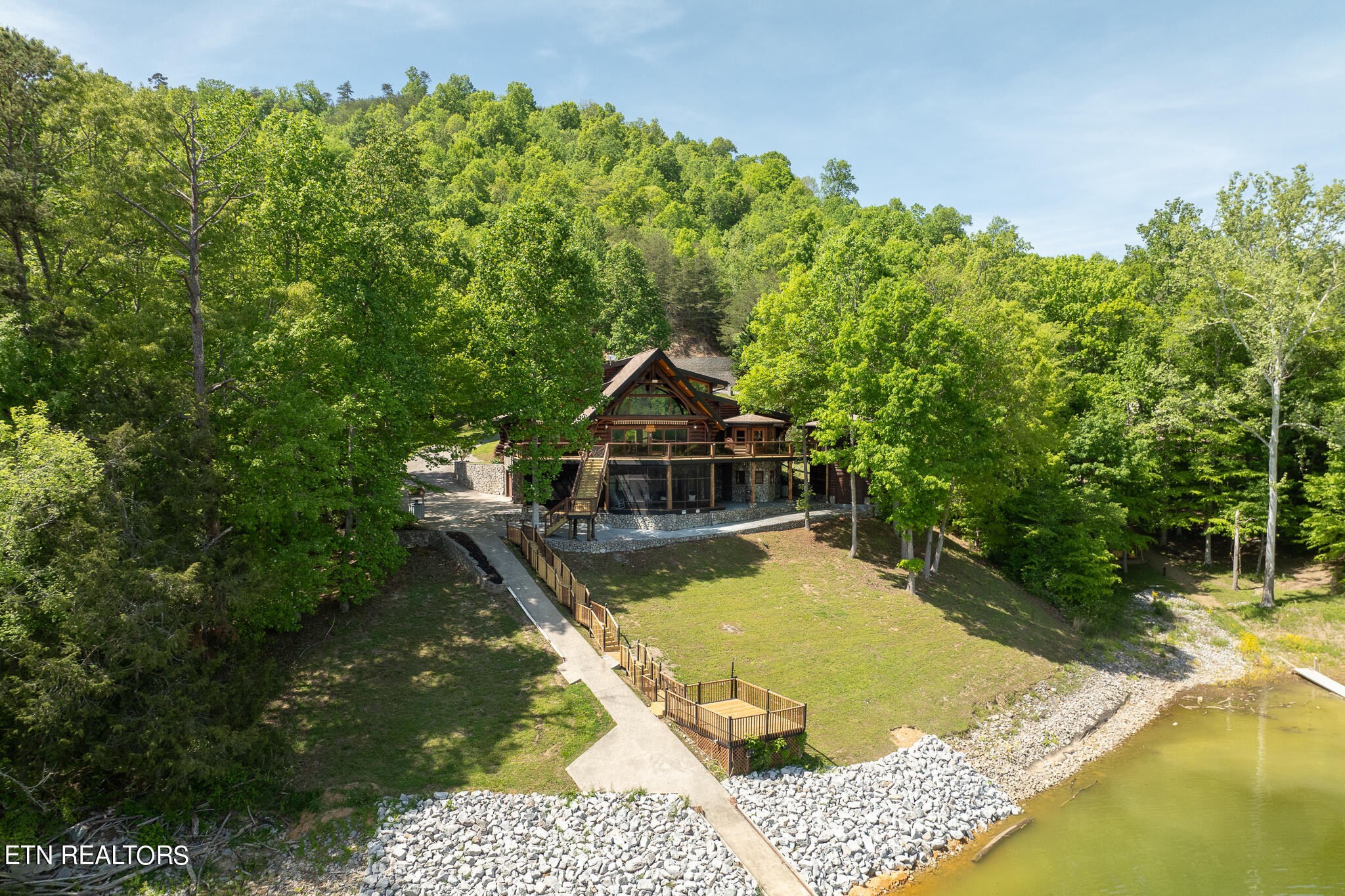 546 Bluff View Road New Tazewell, TN 37825 - Photo 54 of 60 a small pool with some trees in the background