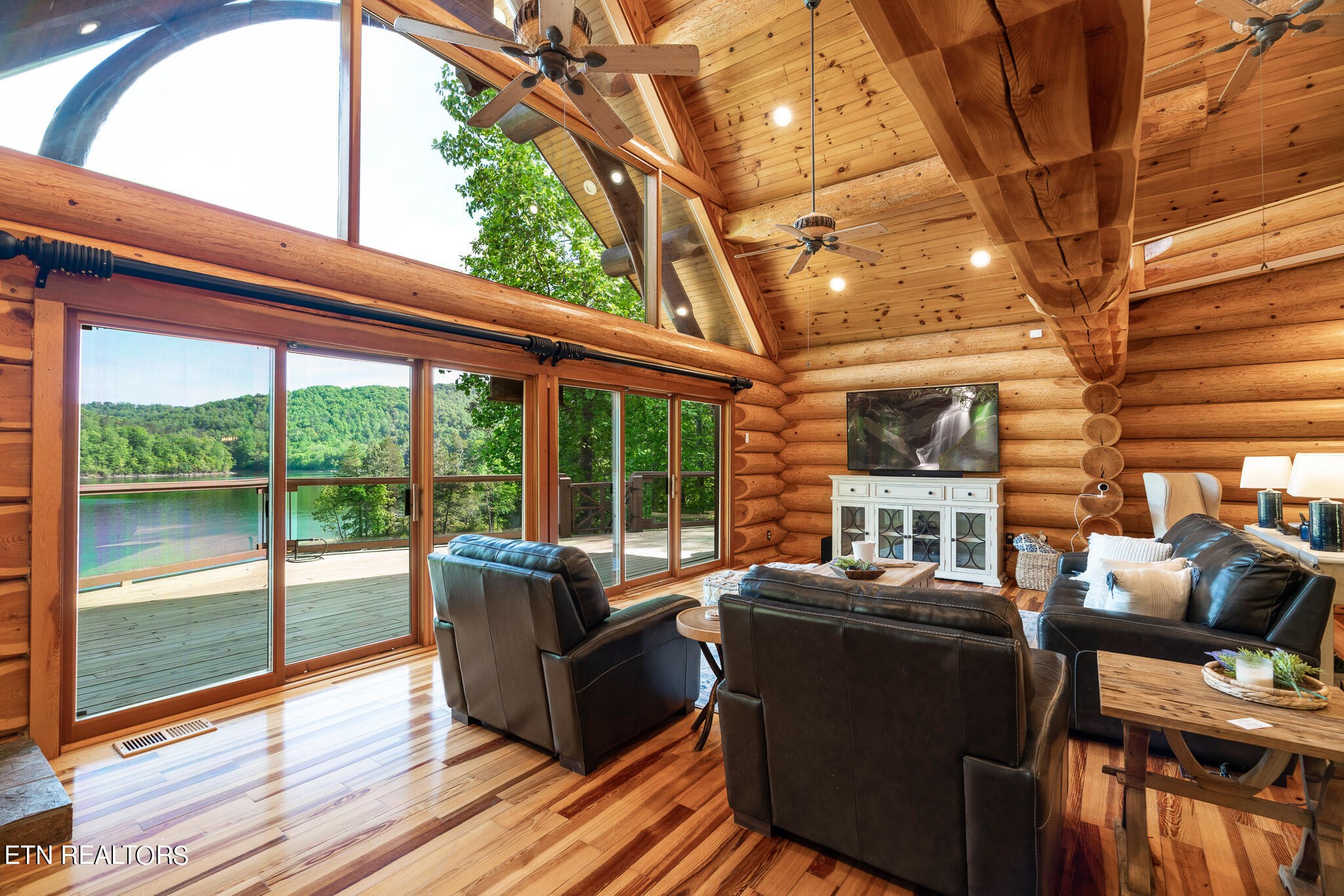 546 Bluff View Road New Tazewell, TN 37825 - Photo 8 of 60 a balcony with furniture and wooden floor