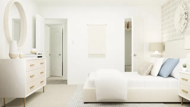 a bedroom with a bed and a mirror