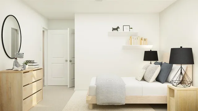 a bedroom with a bed and a dresser