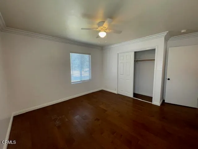 a bathroom with a double vanity sink toilet and mirror