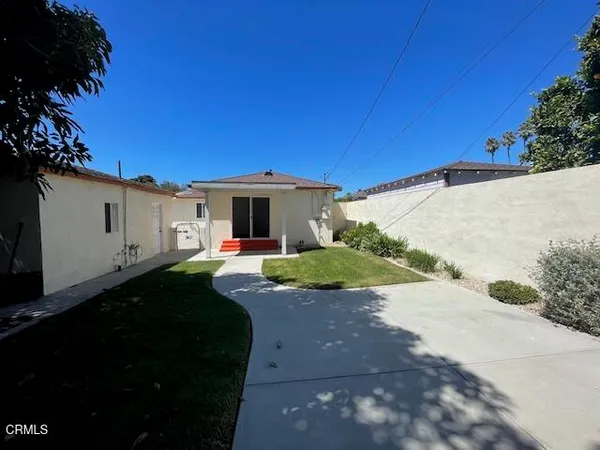 a front view of a house with yard