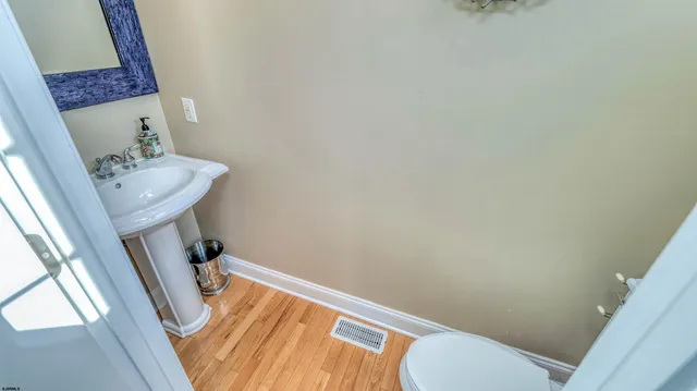 a bathroom with a sink and toilet