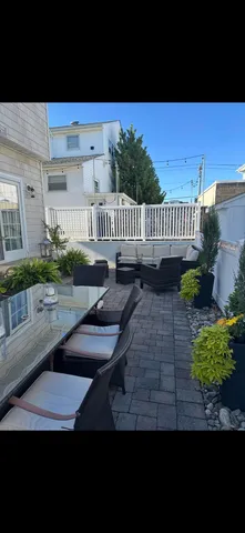 a view of a back yard of the house and a yard