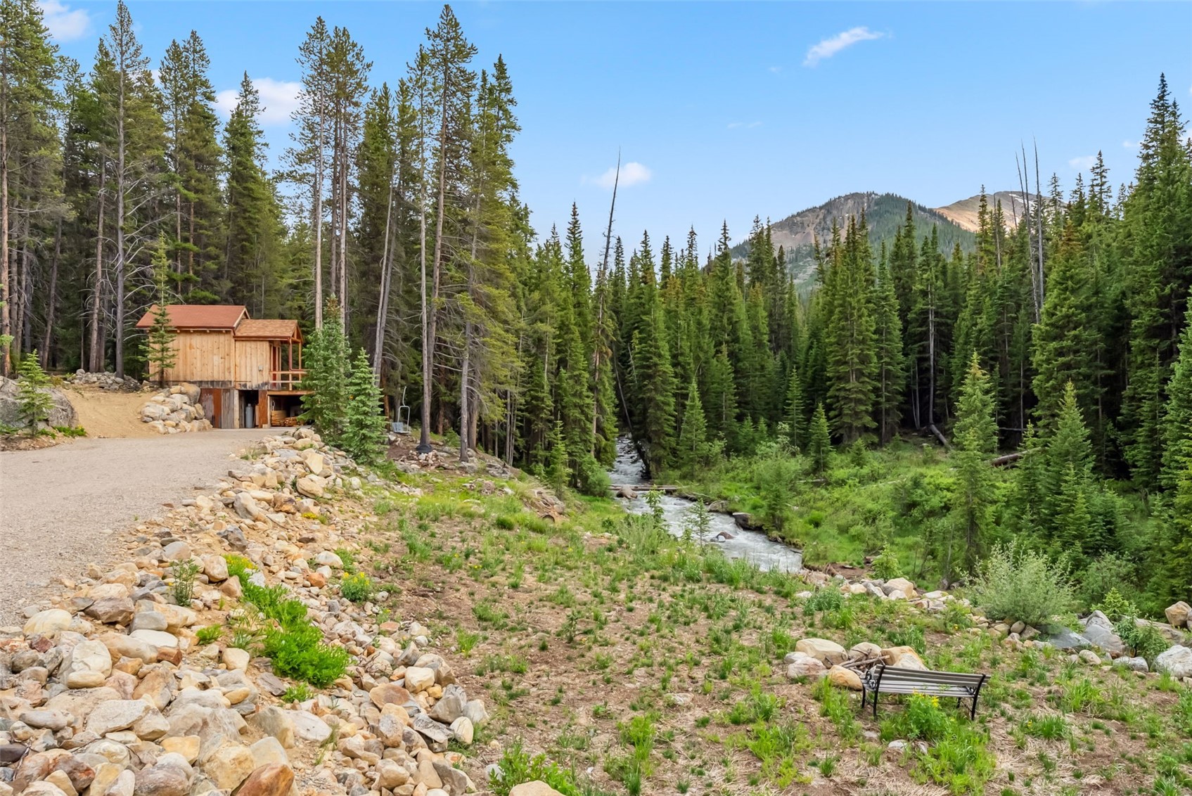 5080 Montezuma Road Dillon, CO 80435 - Photo 11 of 24 a backyard of a house with lots of green space