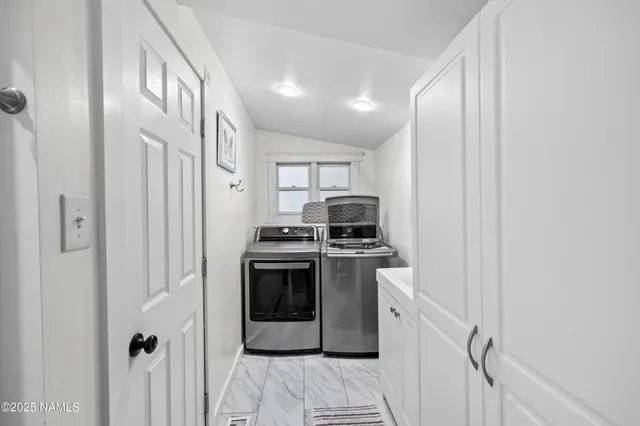 a kitchen with stainless steel appliances granite countertop a stove and a refrigerator