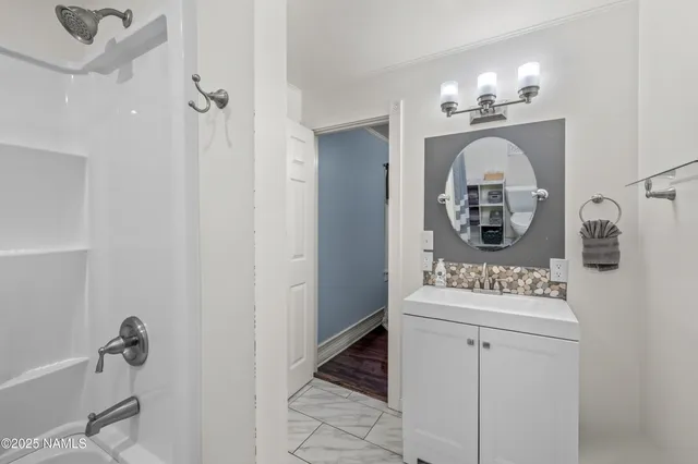 a bathroom with a sink dryer and washer