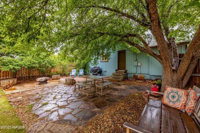 a view of a backyard with sitting area