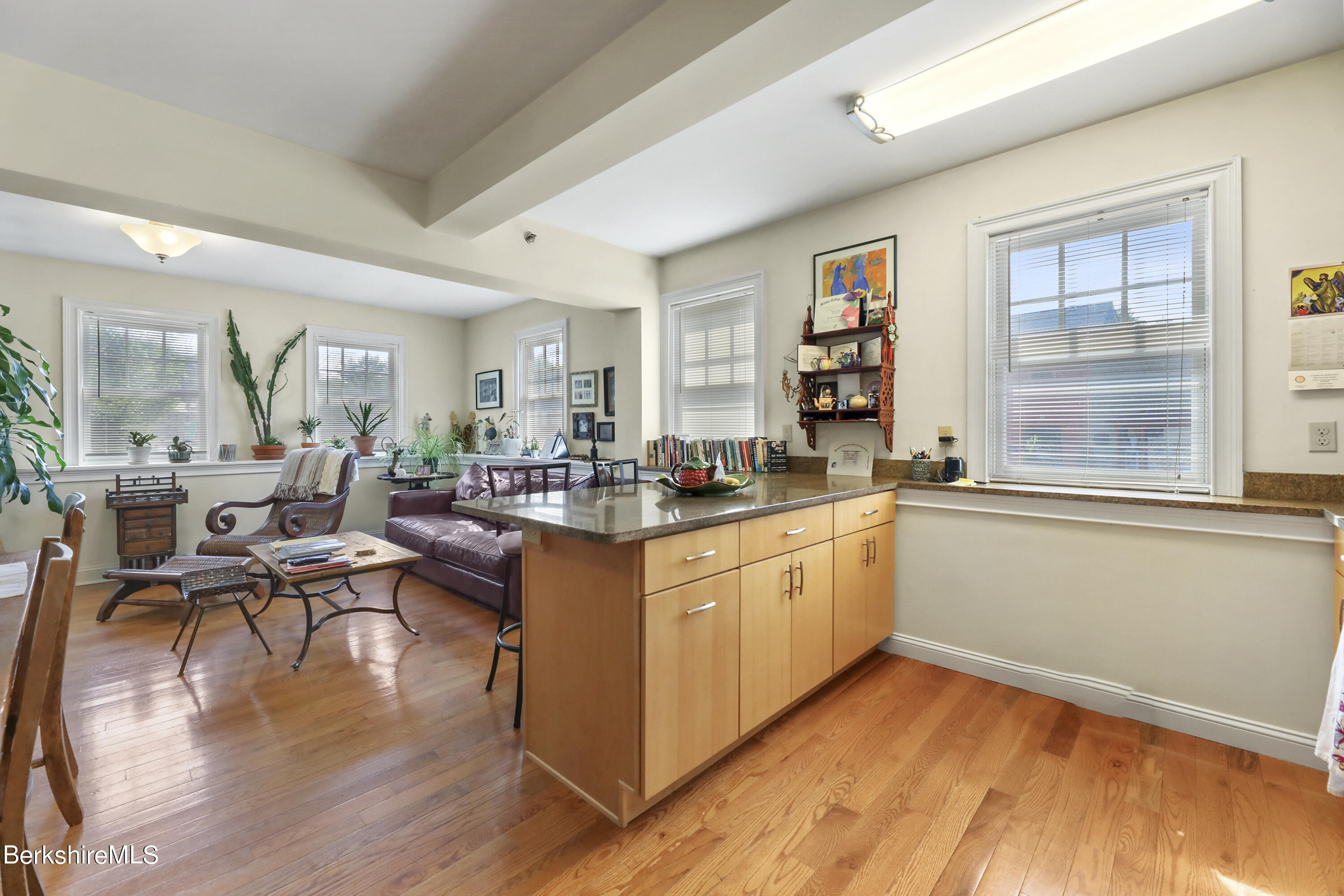 29 Main Street West Stockbridge, MA 01266 - Photo 12 of 51 a very nice looking living room with kitchen island wooden floor and a window