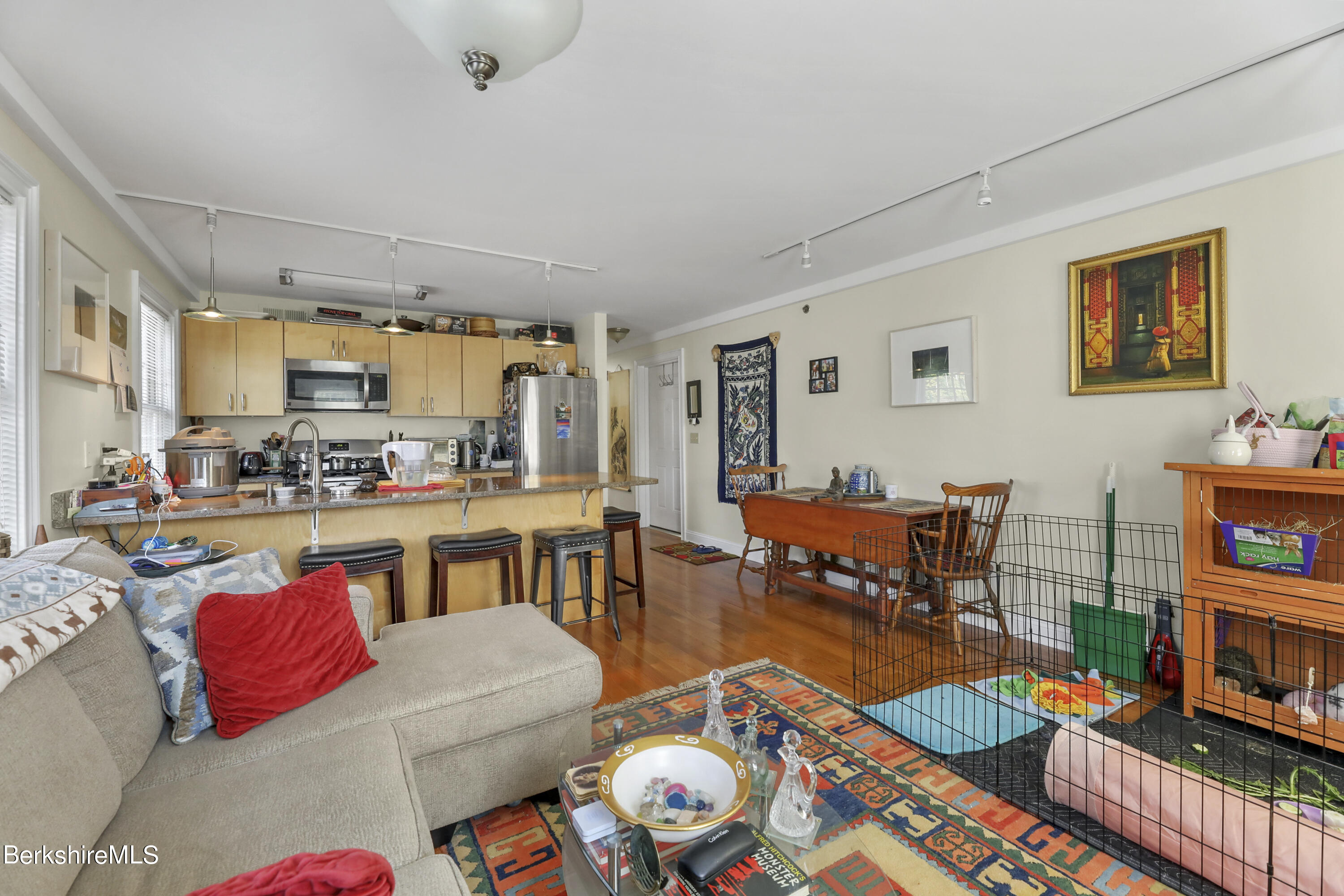 29 Main Street West Stockbridge, MA 01266 - Photo 24 of 51 a living room with furniture and a dining table with wooden floor