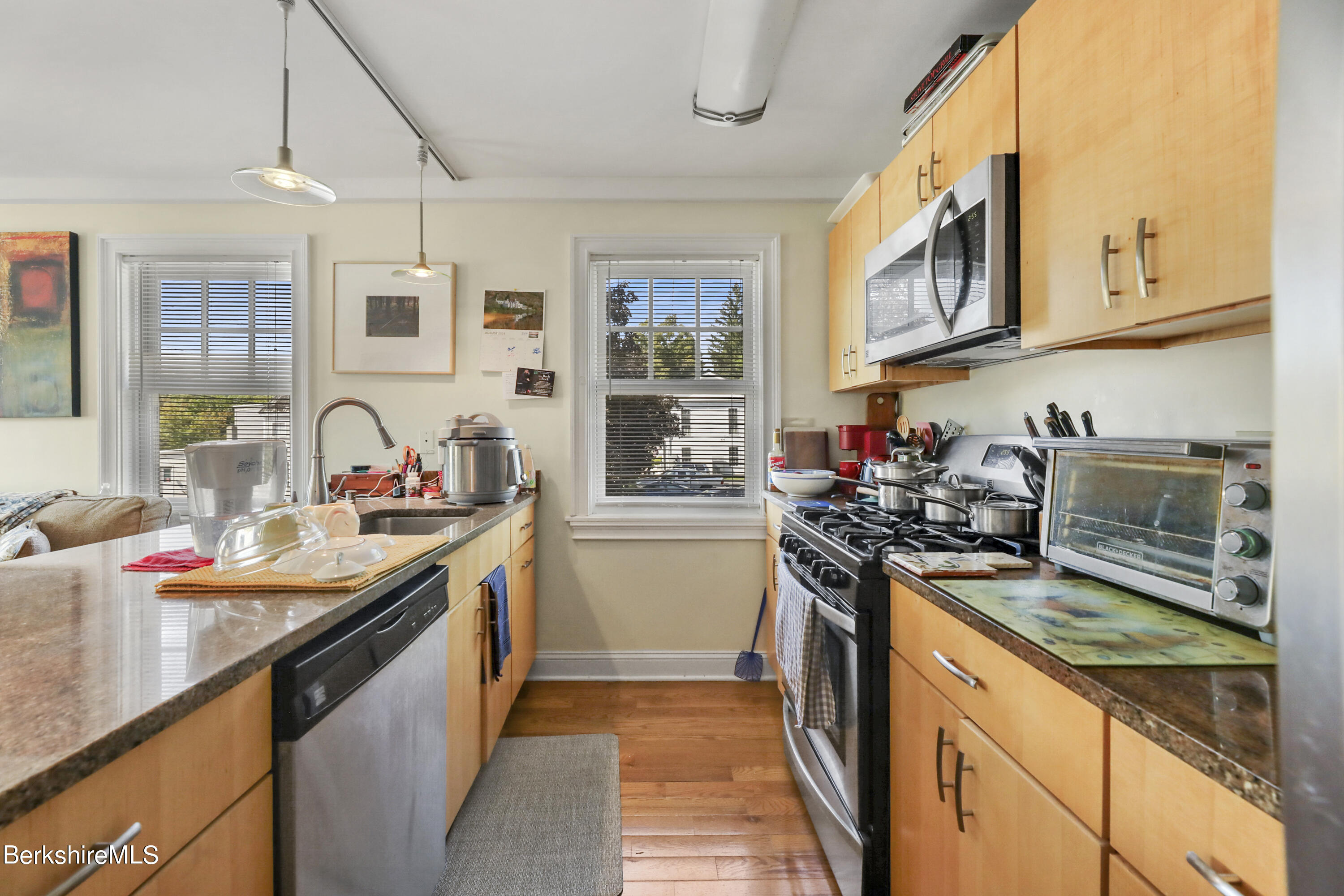 29 Main Street West Stockbridge, MA 01266 - Photo 26 of 51 a kitchen with stainless steel appliances granite countertop a sink stove and refrigerator