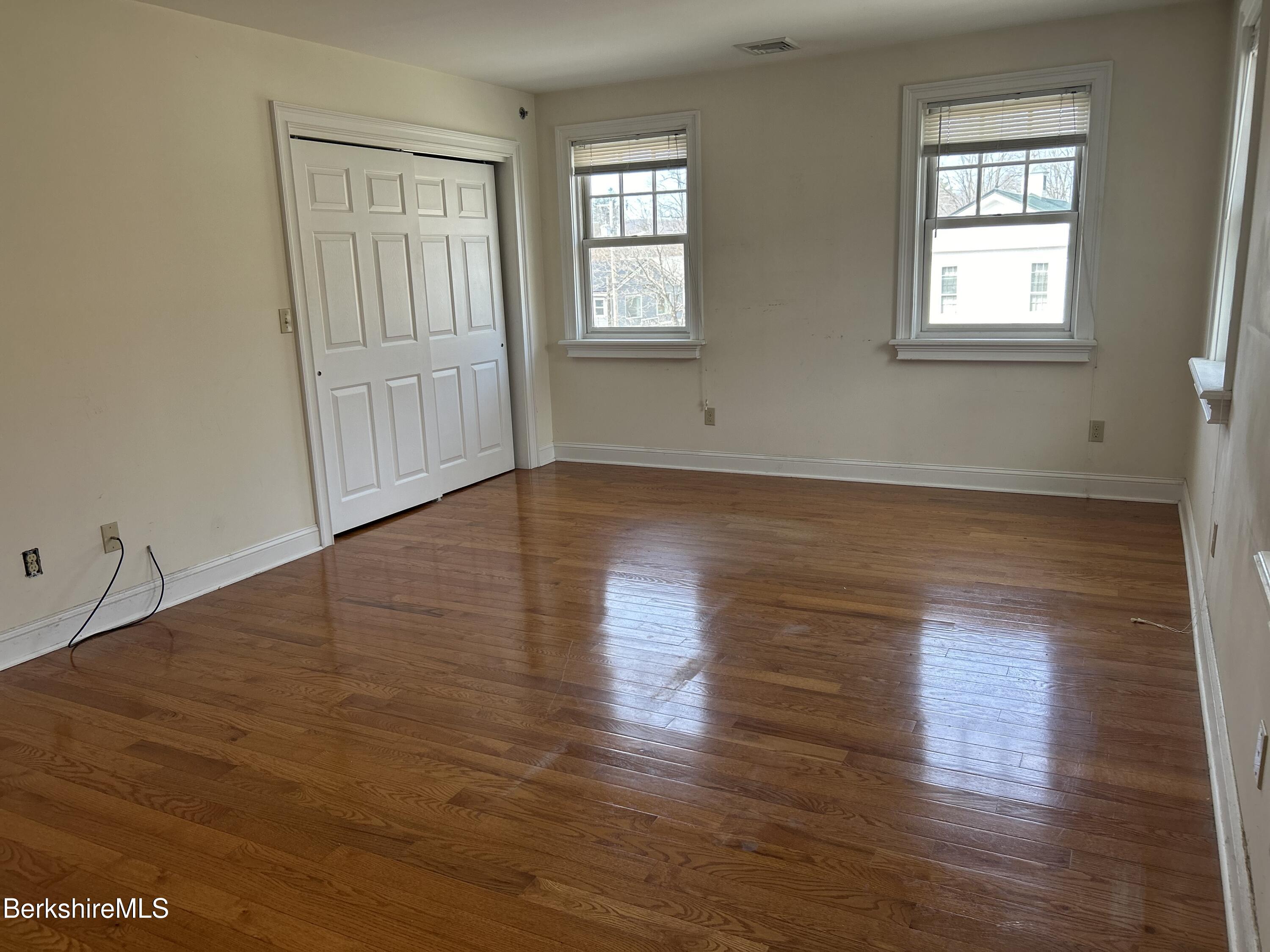 29 Main Street West Stockbridge, MA 01266 - Photo 47 of 51 an empty room with wooden floor and windows