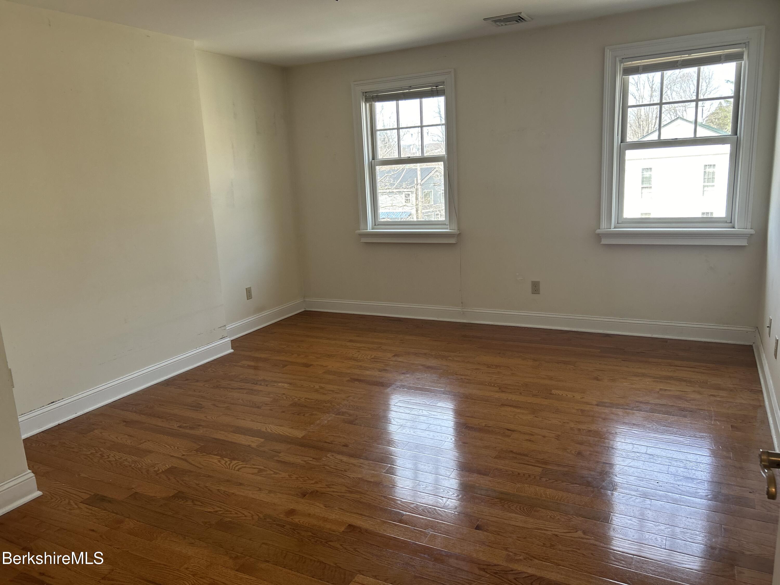 29 Main Street West Stockbridge, MA 01266 - Photo 48 of 51 an empty room with wooden floor and windows