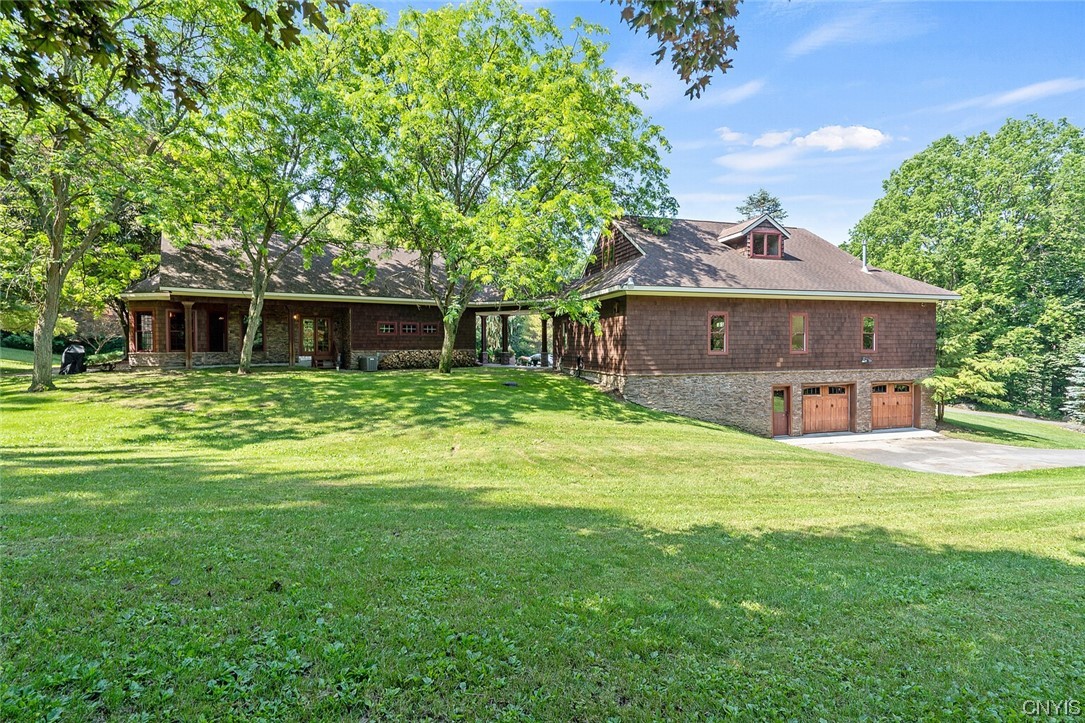 2556 Lyons Road Camillus, NY 13031 - Photo 42 of 49 Side view with mezzanine level garage