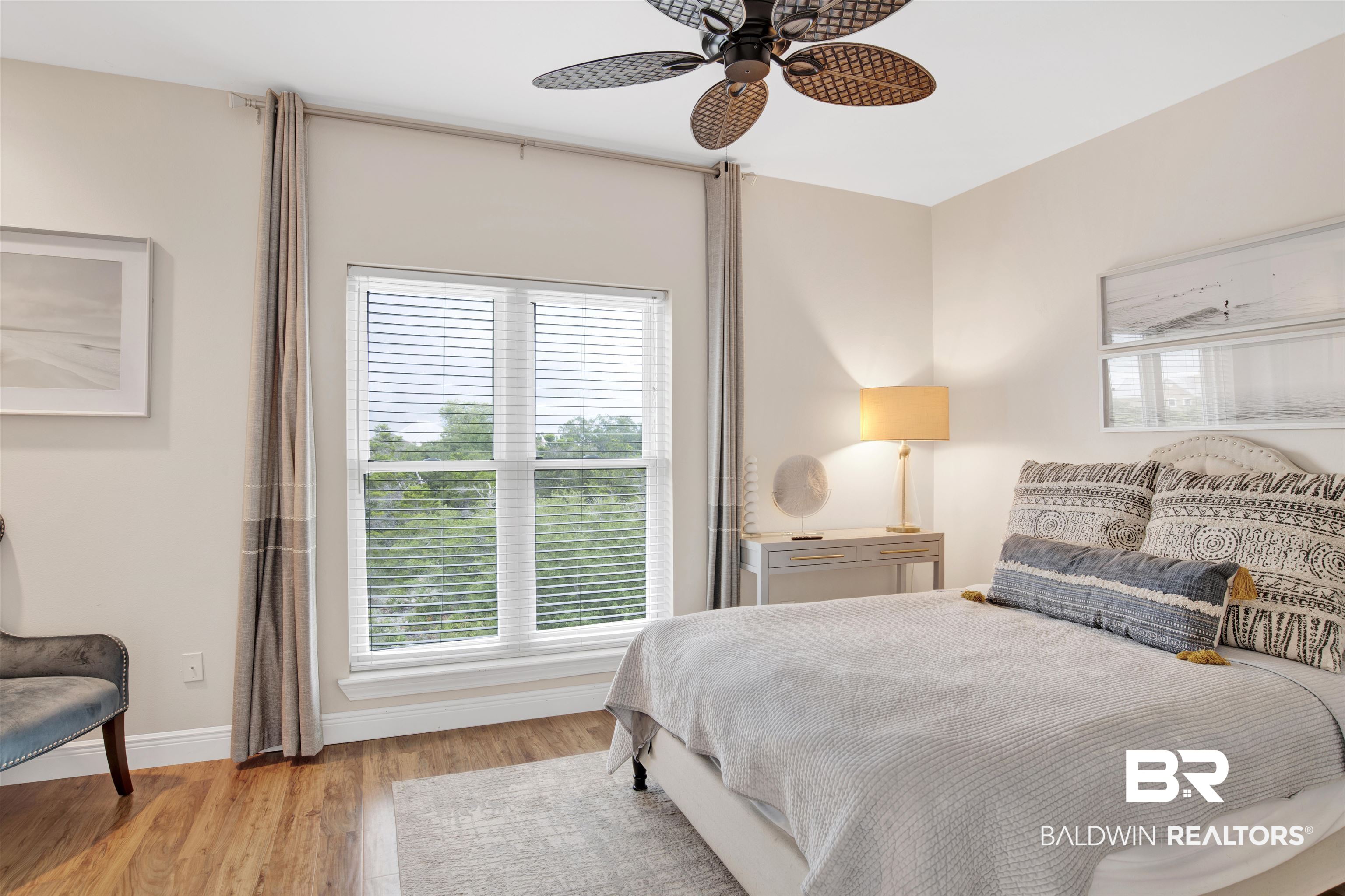 30351 River Road Orange Beach, AL 36561 - Photo 24 of 44 Bright room featuring wood-finish flooring, a large window with blinds, and recessed lighting