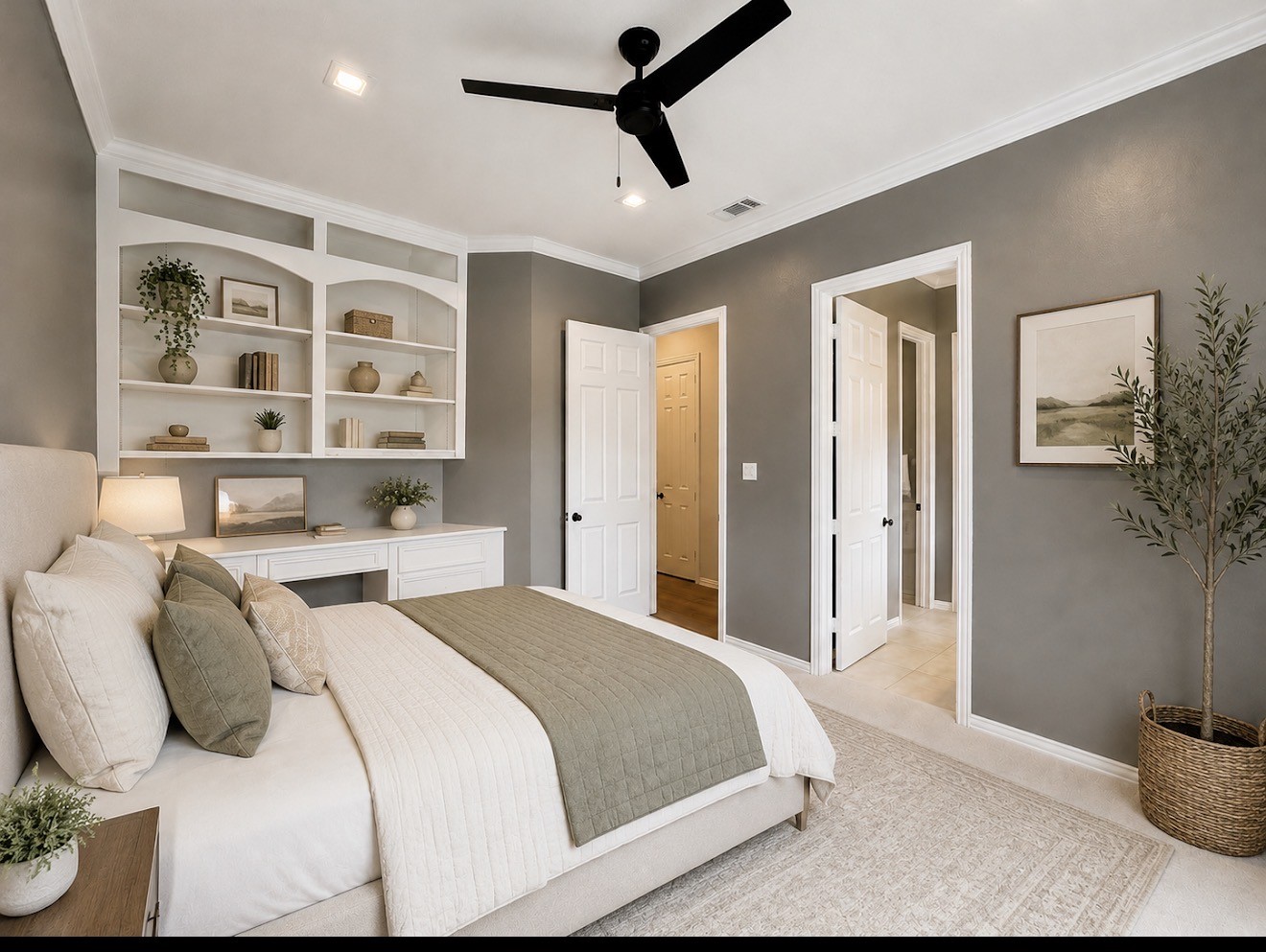 1810 Woerner Road Houston, TX 77090 - Photo 29 of 39 Cozy downstairs bedroom featuring built-in shelving, a stylish desk, and abundant natural light.
