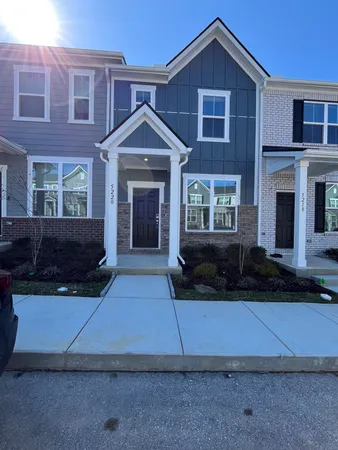 a front view of a house with yard