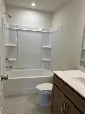 a bathroom with a sink a toilet and a bathtub
