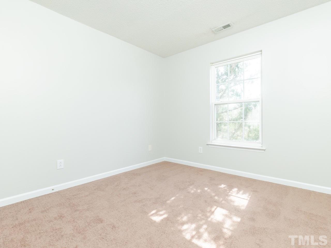 5801 Weddington Road Raleigh, NC 27610 - Photo 18 of 28 an empty room with a window
