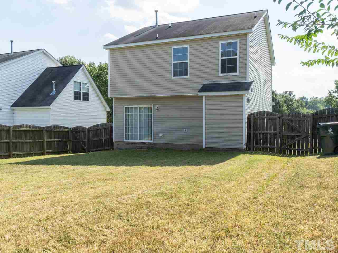 5801 Weddington Road Raleigh, NC 27610 - Photo 26 of 28 a front view of a house with a yard