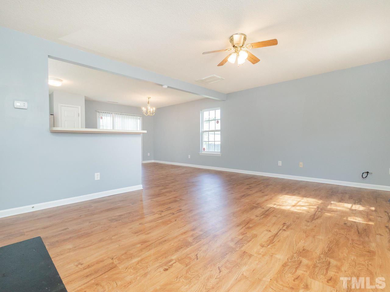 5801 Weddington Road Raleigh, NC 27610 - Photo 6 of 28 wooden floor in an empty room with a window