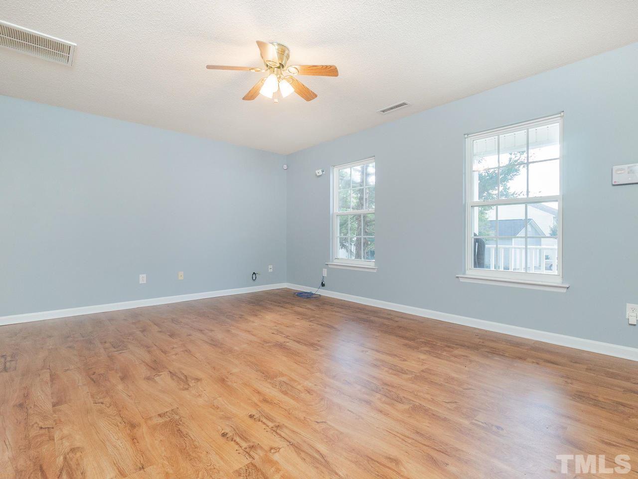 5801 Weddington Road Raleigh, NC 27610 - Photo 7 of 28 an empty room with windows and fan