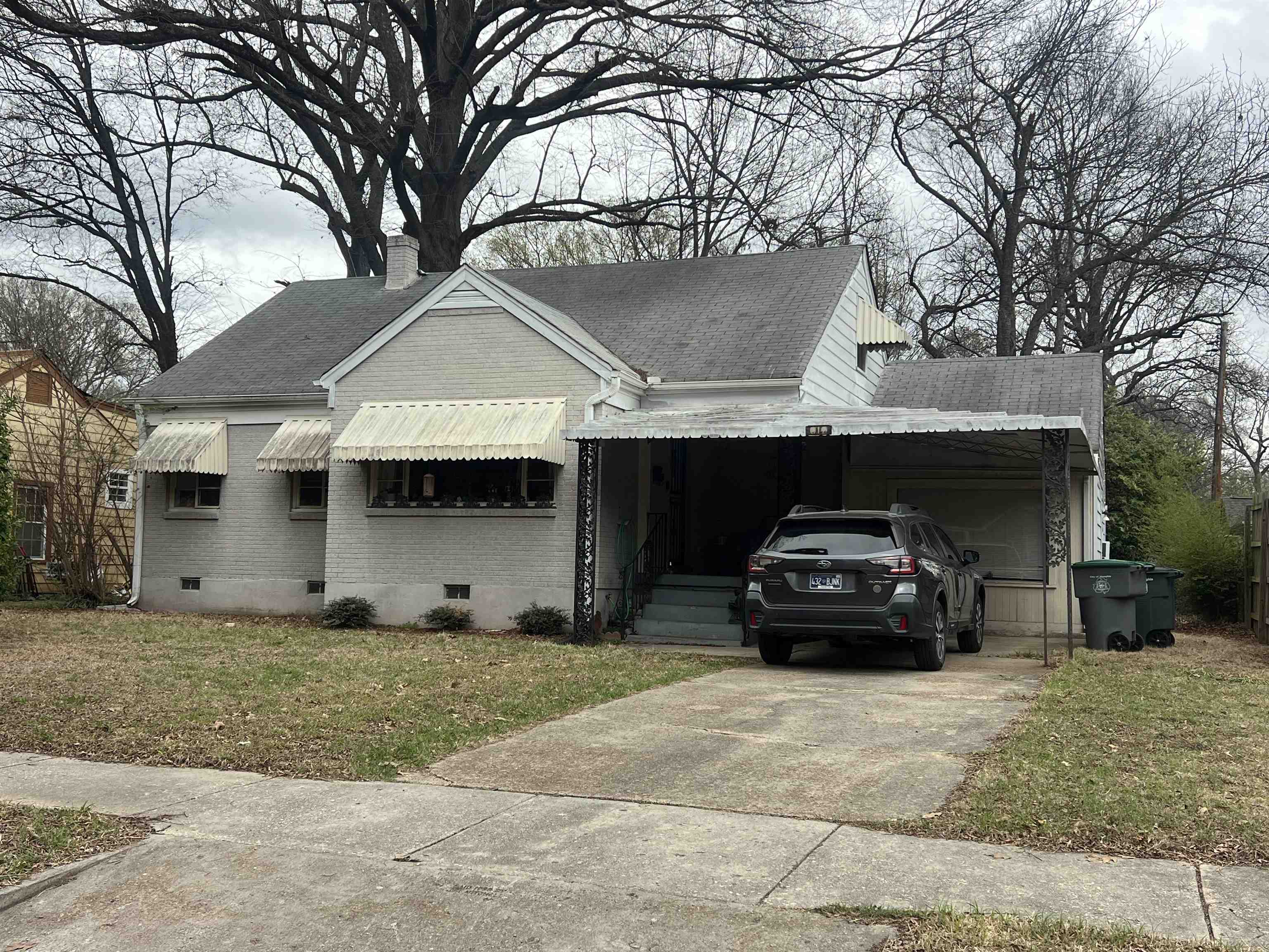 a car parked in front of a house
