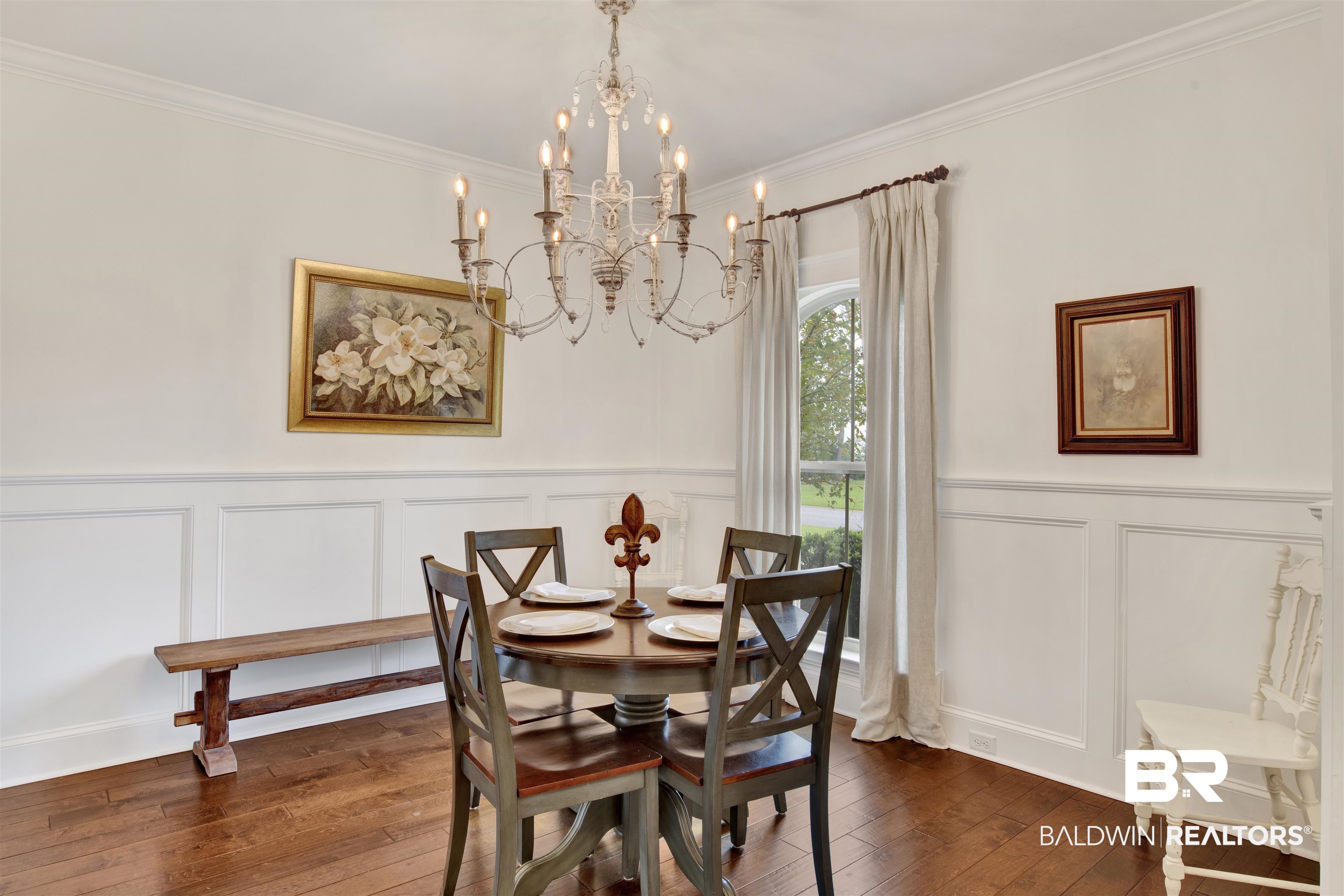 9240 Bay Point Drive Elberta, AL 36530 - Photo 10 of 22 Dining space with ornamental molding, dark hardwood / wood-style floors, and a chandelier