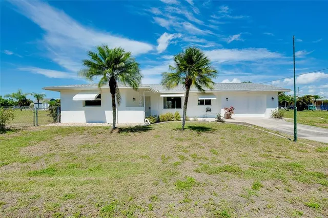 a view of multiple houses with outdoor space