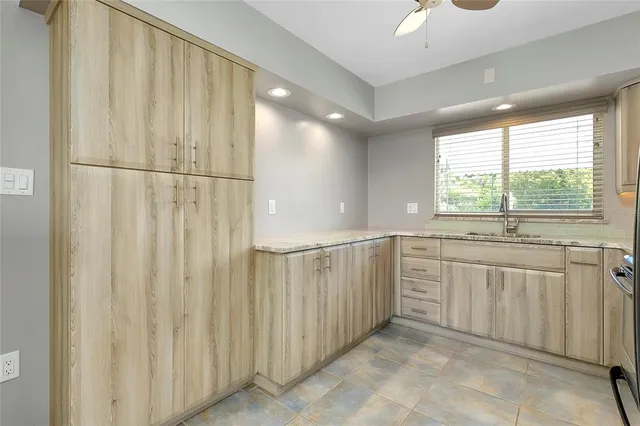 a kitchen with a stove and a refrigerator