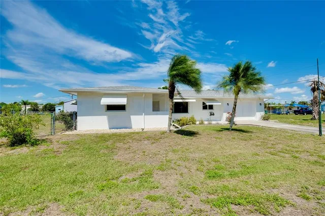 a front view of a house with many windows