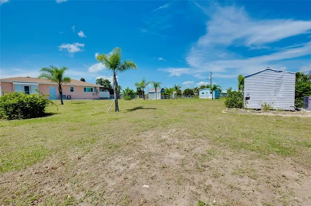 a view of a swimming pool with an outdoor seating