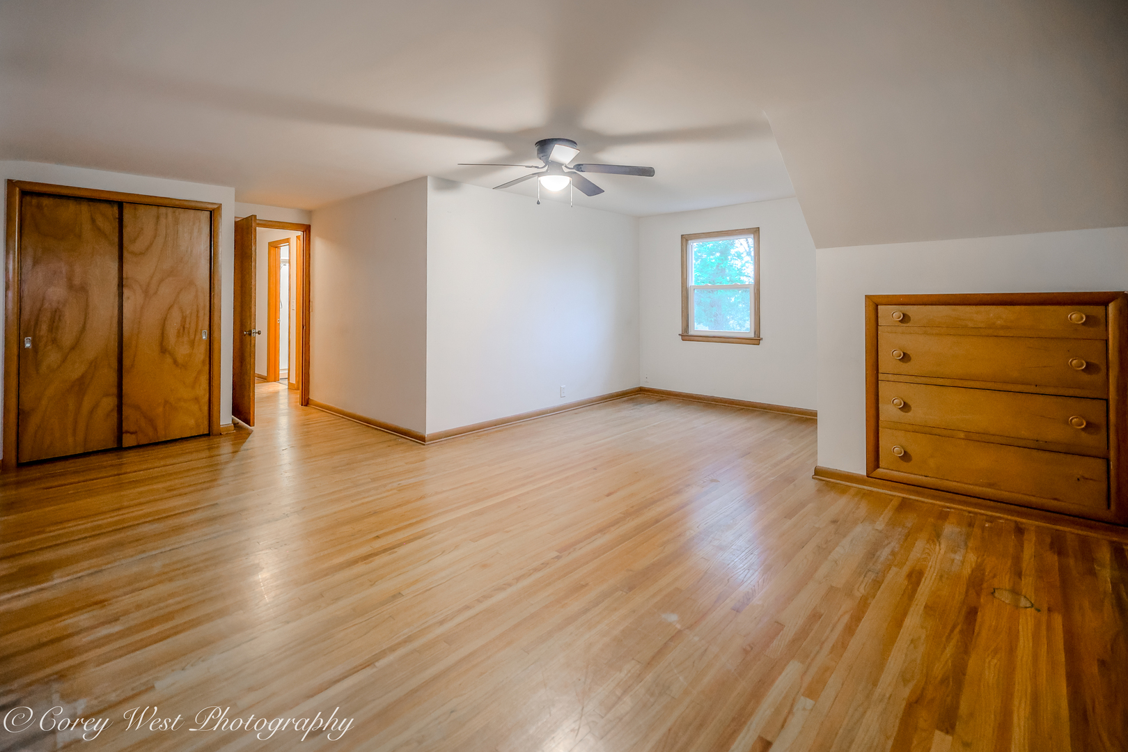 8994 Highway 64 Sycamore, IL 60178 - Photo 20 of 37 an empty room with wooden floor closet and windows
