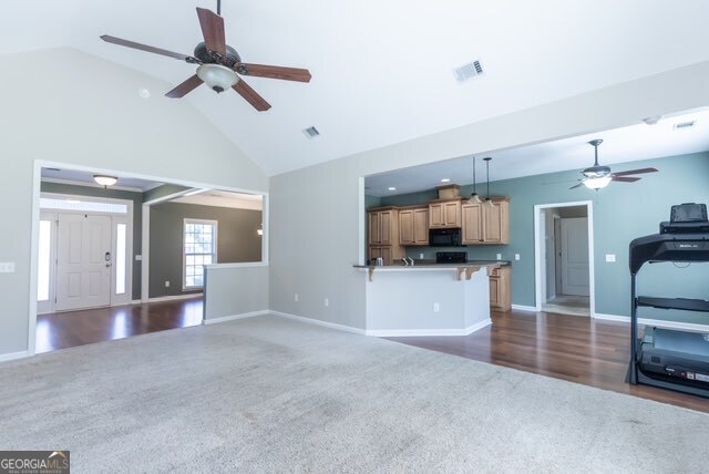 135 Runs Crossing Drive Springfield, GA 31329 - Photo 12 of 38 a view of a big room with windows and a kitchen