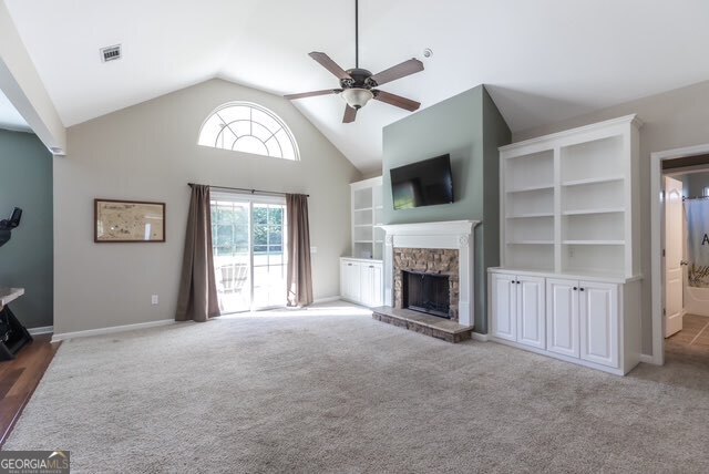 135 Runs Crossing Drive Springfield, GA 31329 - Photo 14 of 38 a view of a livingroom with a fireplace a ceiling fan and windows