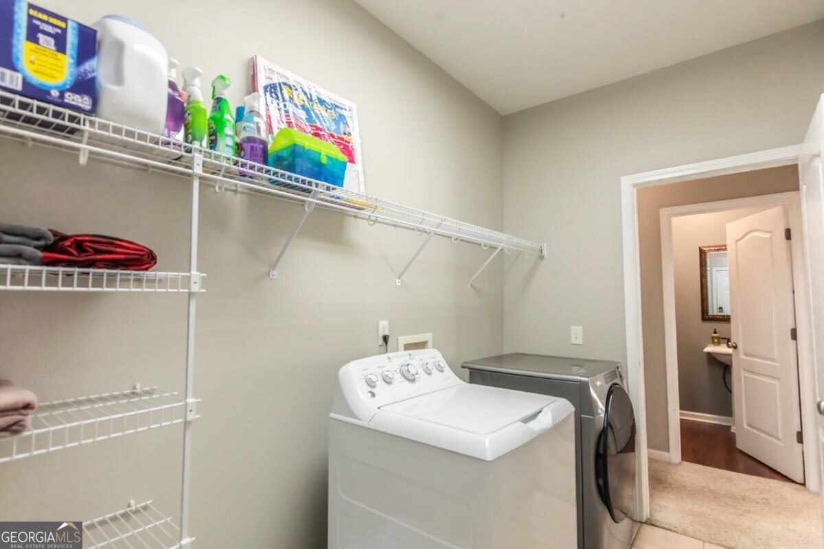 135 Runs Crossing Drive Springfield, GA 31329 - Photo 19 of 38 a utility room with dryer and washer