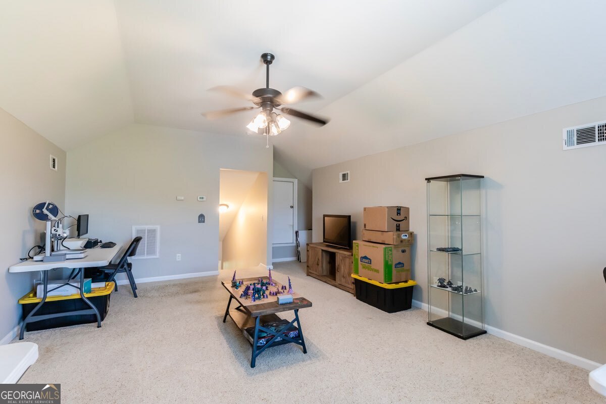 135 Runs Crossing Drive Springfield, GA 31329 - Photo 26 of 38 a kids room with toys and a chandelier