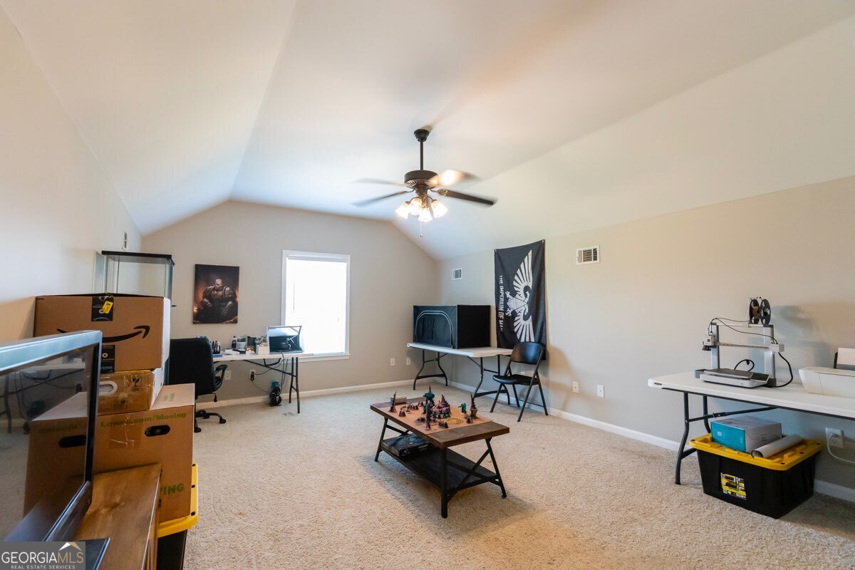 135 Runs Crossing Drive Springfield, GA 31329 - Photo 27 of 38 a living room with furniture and a flat screen tv