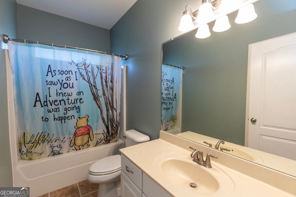 135 Runs Crossing Drive Springfield, GA 31329 - Photo 28 of 38 a bathroom with a sink a toilet and a mirror