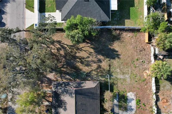 an aerial view of residential house with outdoor space