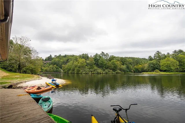 a view of a lake with tables and lake view