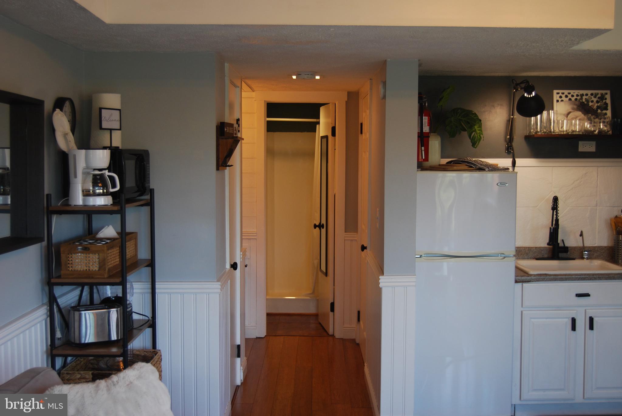 141 The Hill Road, Unit 25A Basye, VA 22810 - Photo 13 of 18 a view of hallway with cabinet and hallway