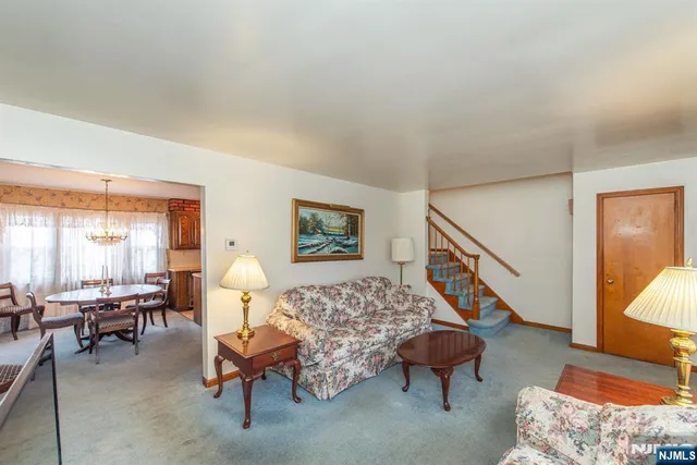 a living room with furniture and a rug
